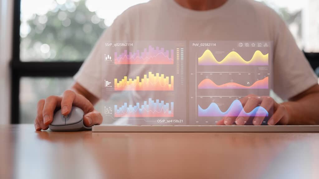 Marketing analyst reviewing engagement dashboard data on a laptop