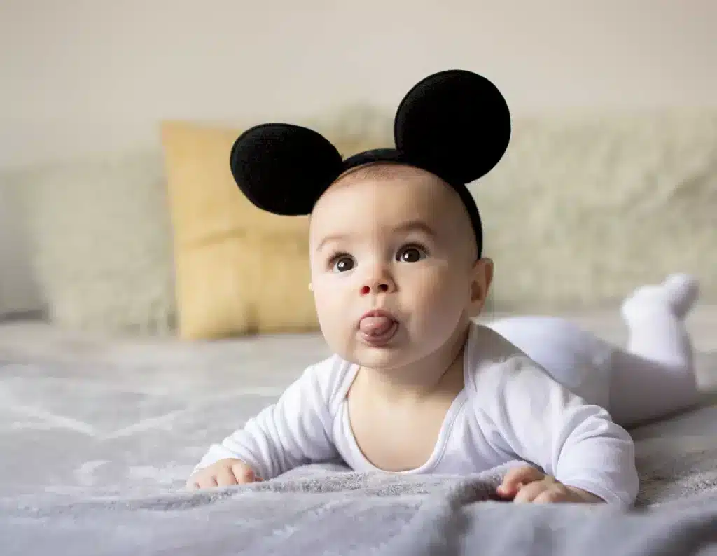 Baby wearing Mickey Mouse ears