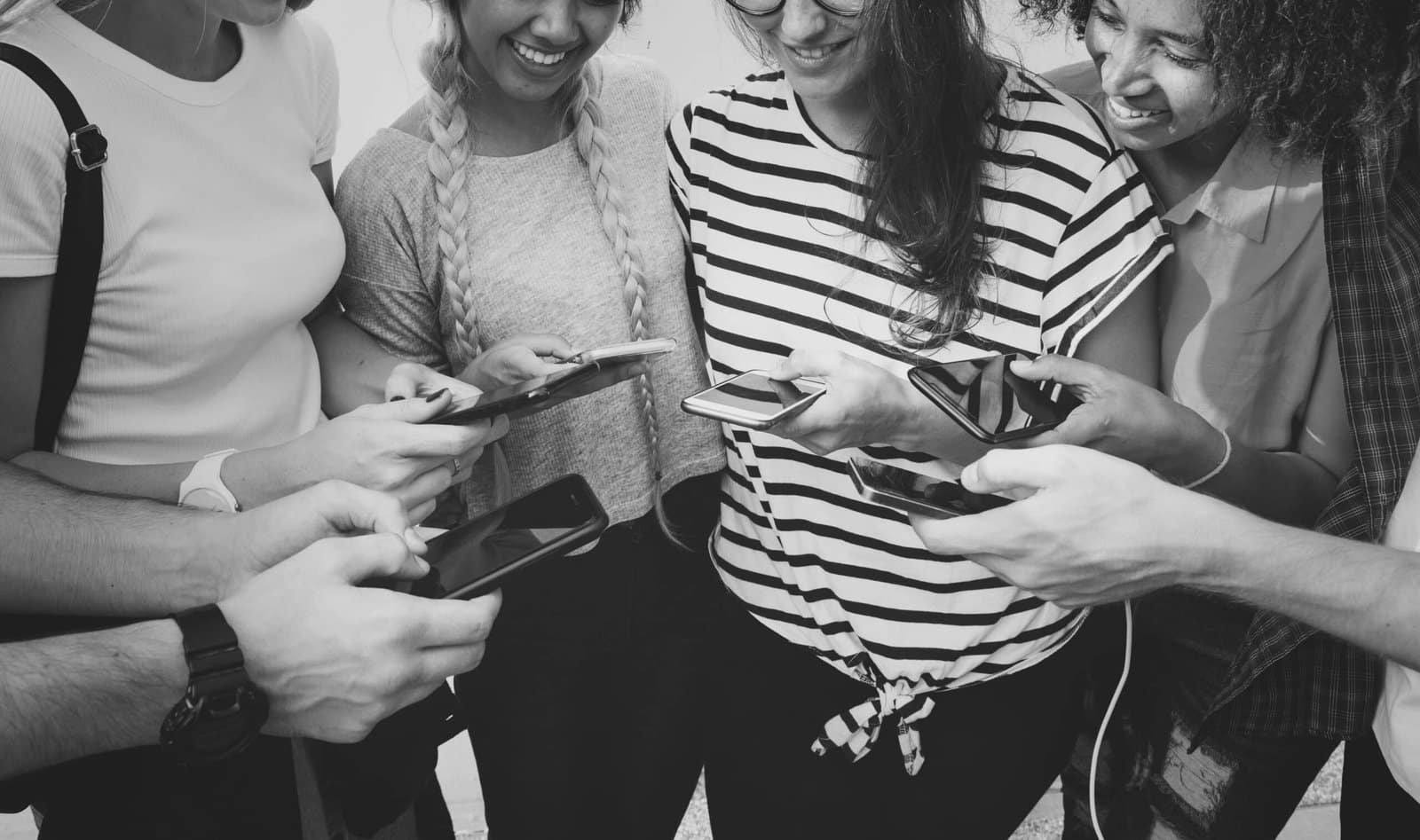Young Adults Looking at Smartphones