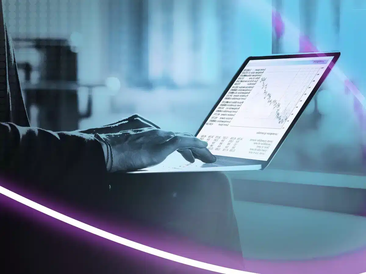 Person analyzing performance data on a laptop